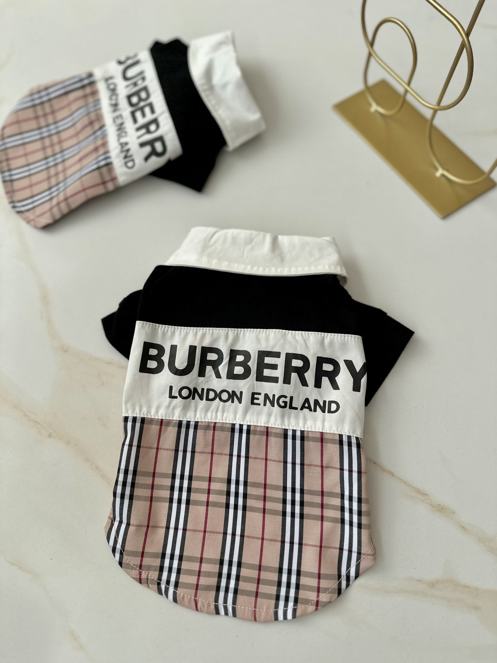 Black polo shirt with Burberry print