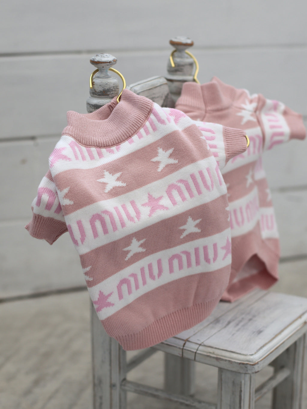 Pink sweater with Miu Miu print