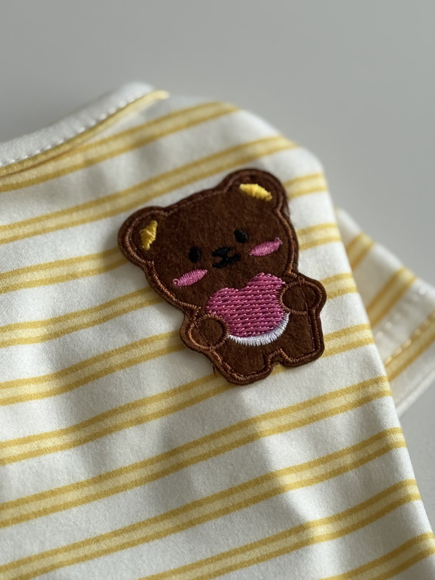 White T-shirt with yellow Teddy Stripes