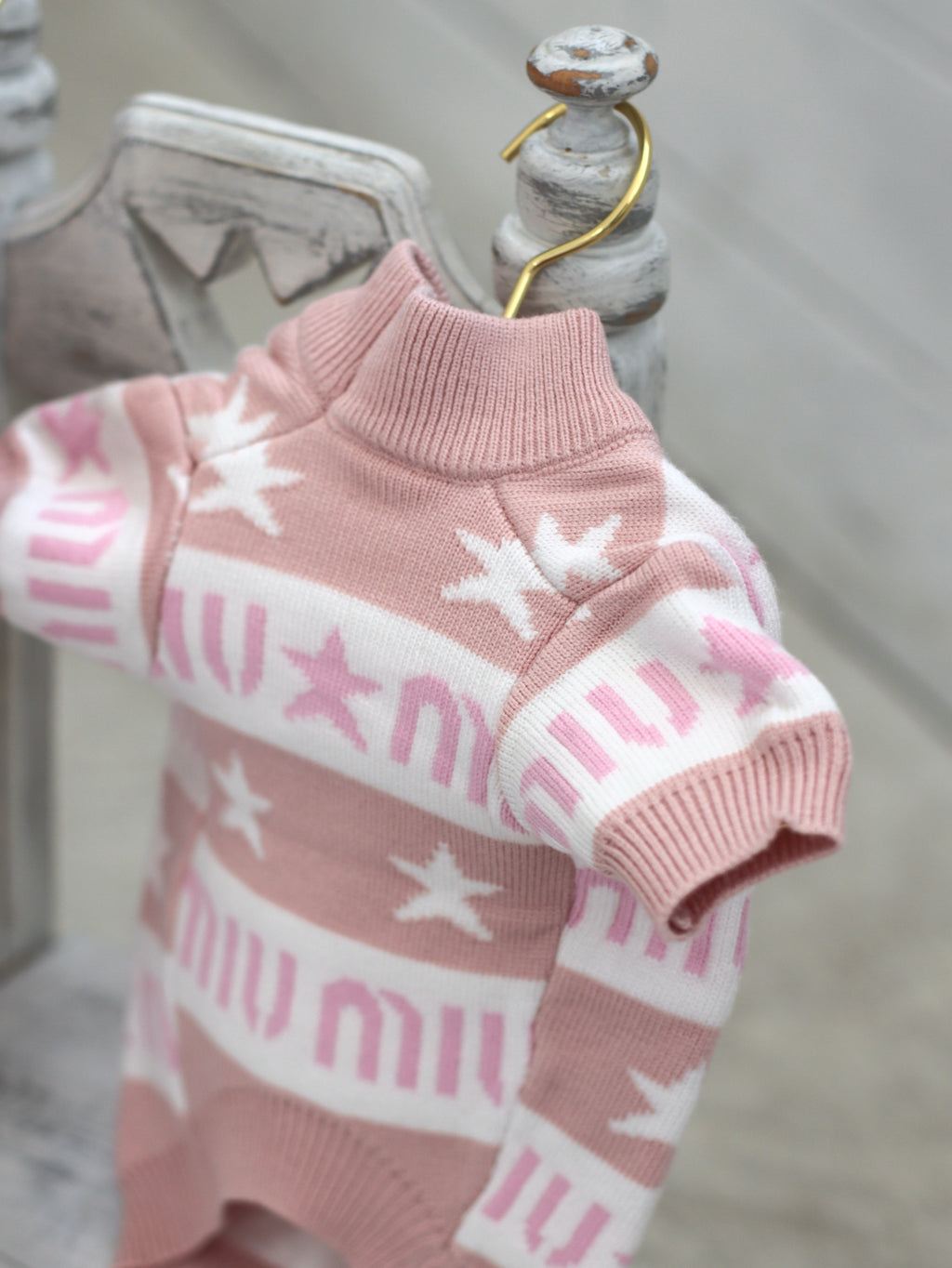 Pink sweater with Miu Miu print
