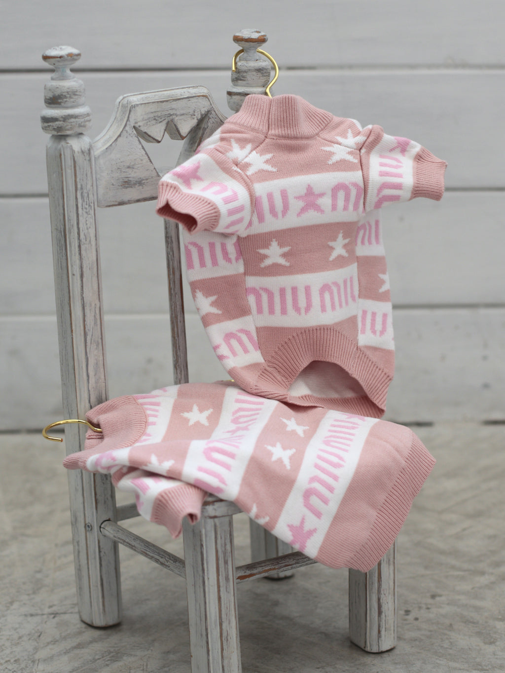 Pink sweater with Miu Miu print
