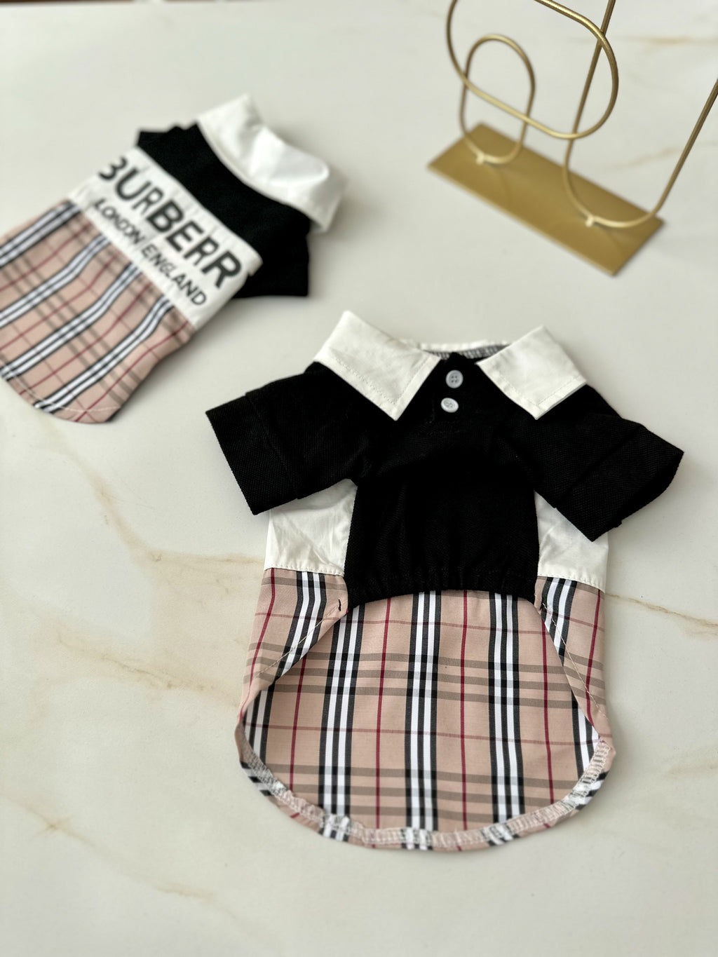 Black polo shirt with Burberry print