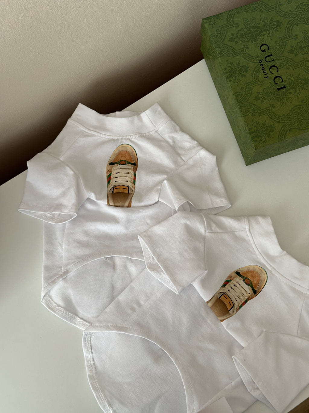 White T-shirt with sneakers and Gucci print