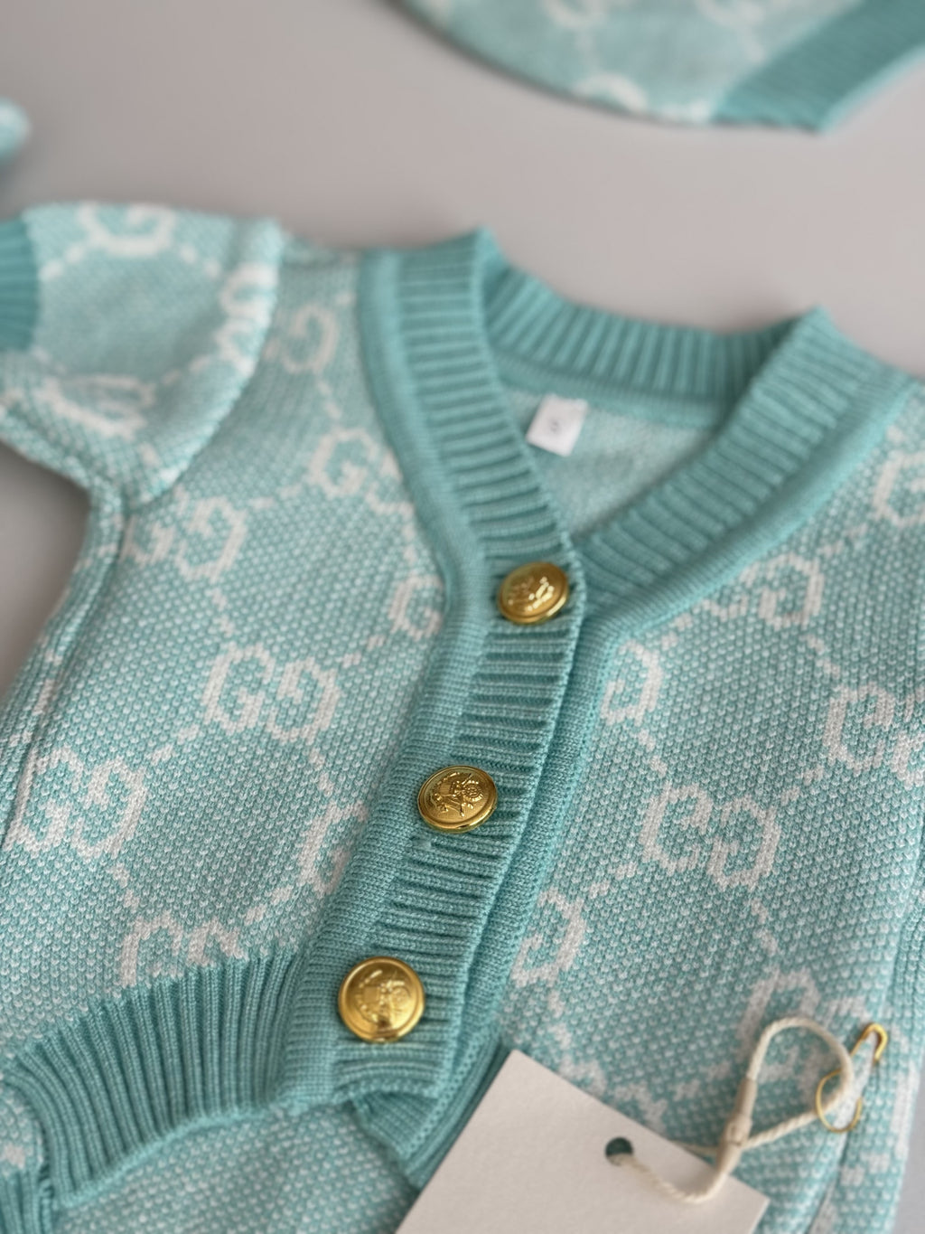 Turquoise cardigan with Gucci print
