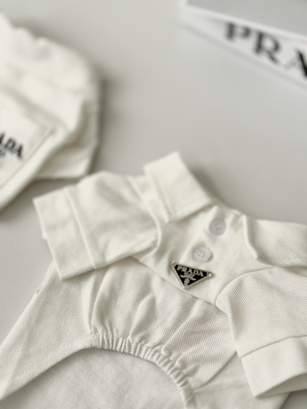 White polo shirt with Prada print